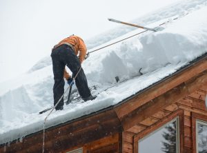 removing snow from roof helps prevent icicles